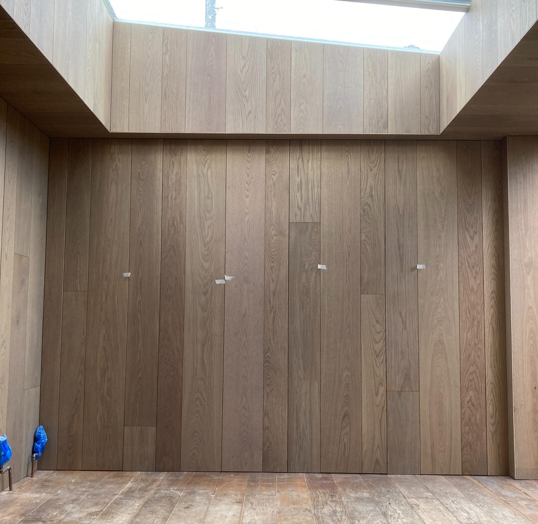Hidden cabinetry and timber cladding