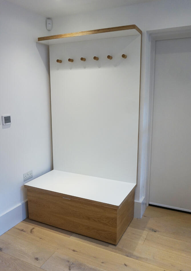 Coat + Shoe store - Stand alone unit to hang coats and store shoes in the secret sliding seat storage